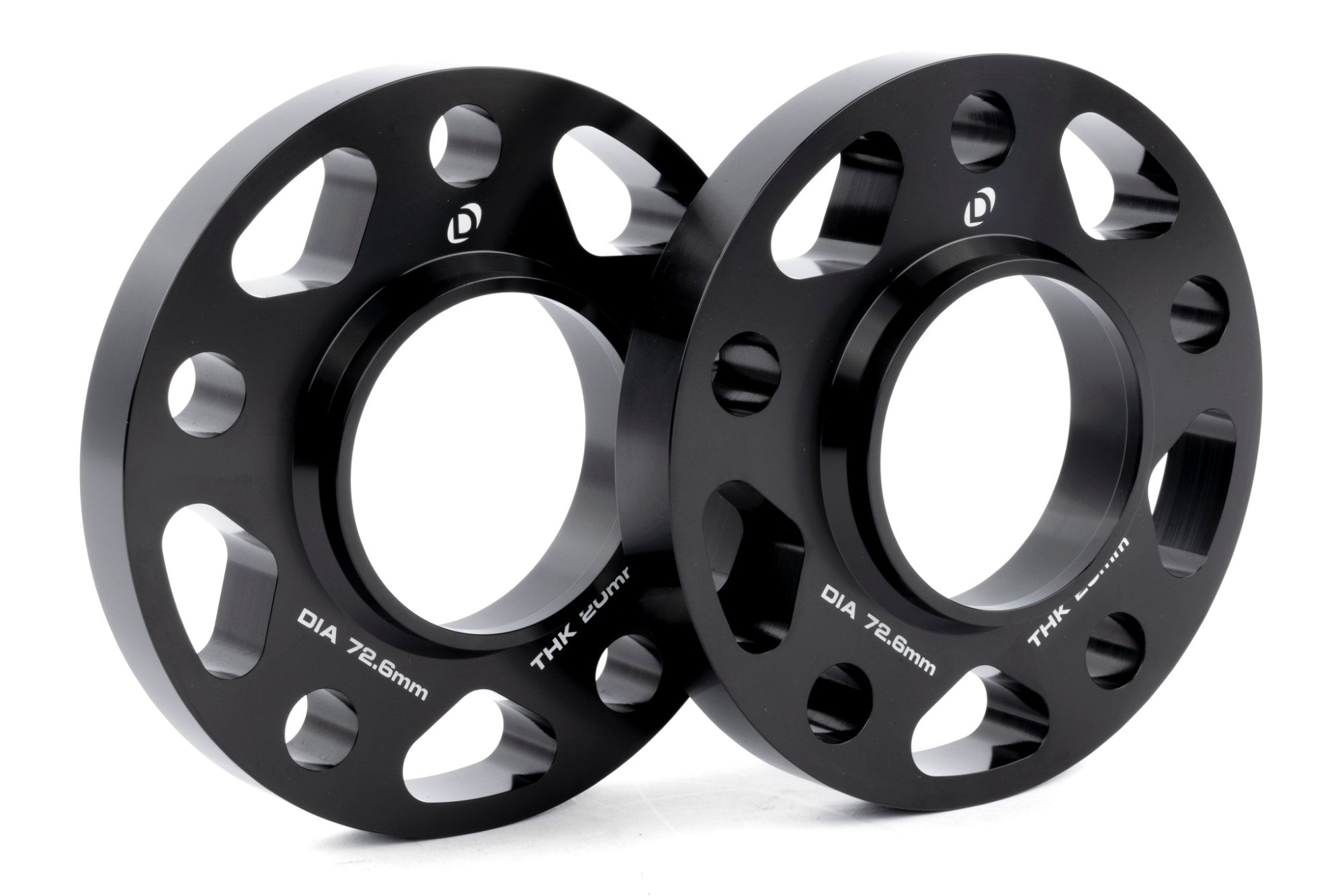 DINAN 5x120 Wheel Spacers with CNC-machined aluminum design and anodized black finish for optimal stance and brake clearance.