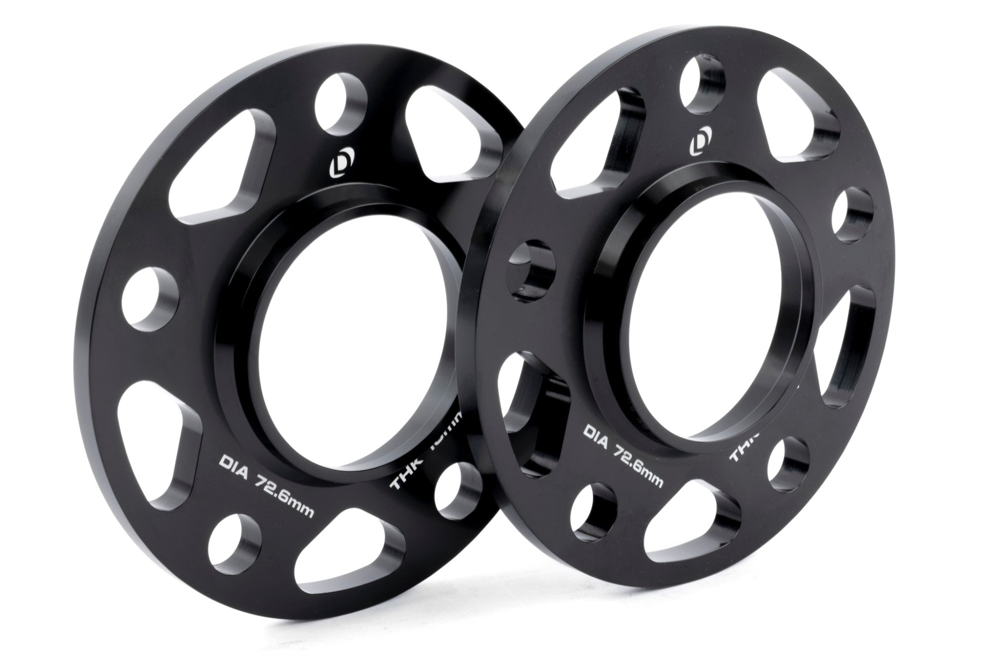 High-quality DINAN hub-centric wheel spacers in black anodized finish, providing improved wheel offset and brake caliper clearance.