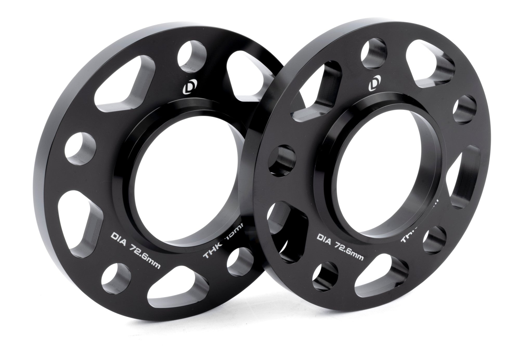 Anodized black DINAN 5x120 Wheel Spacers, offering a lightweight, CNC-machined solution for brake clearance and custom offset.