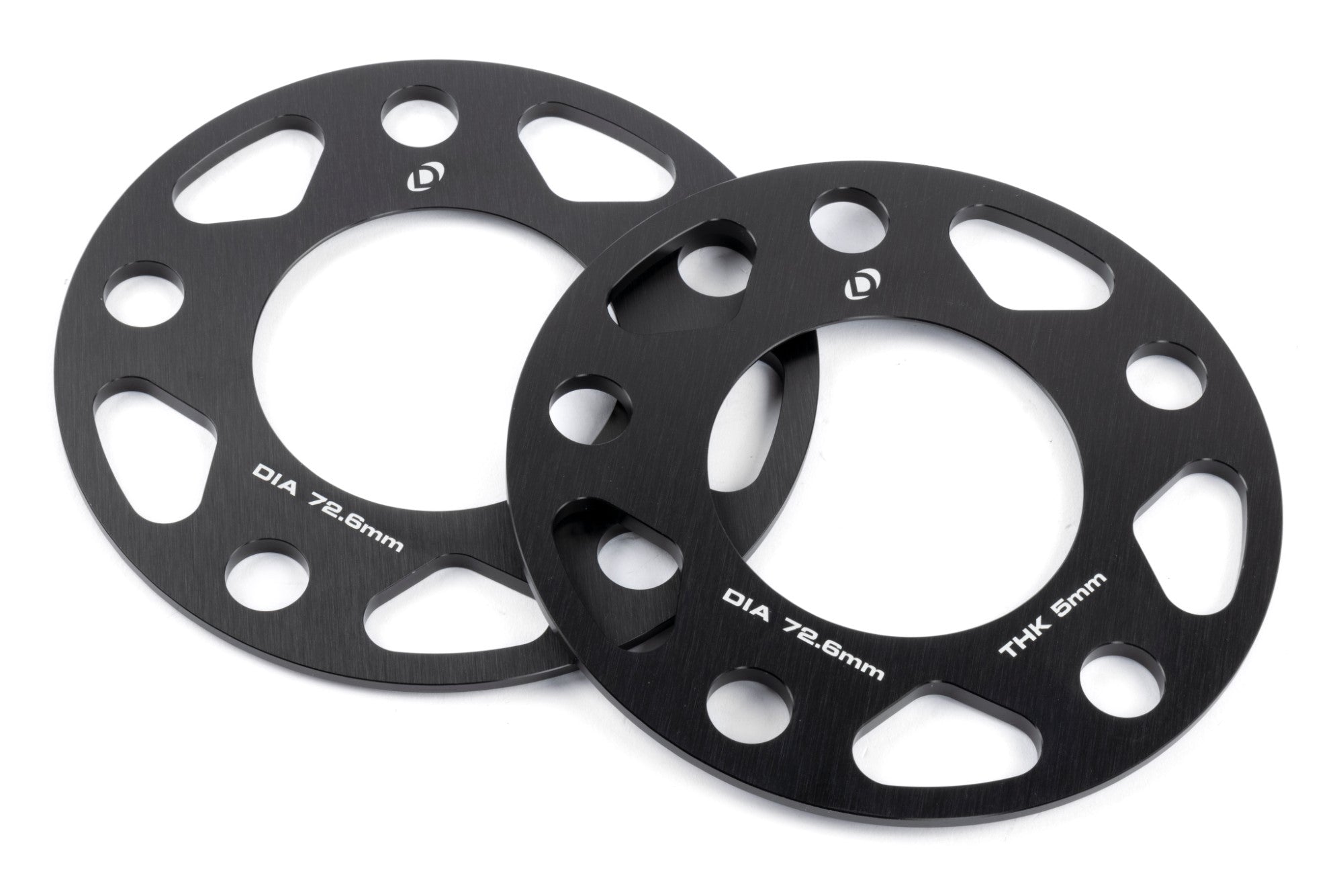 Lightweight, anodized black DINAN 5x120 Wheel Spacers featuring hub-centric rings and multiple thickness options for custom offset.